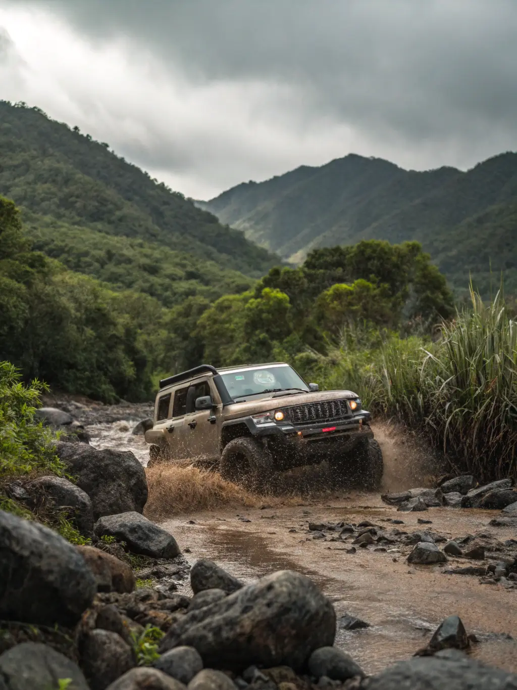 A rugged 4WD tyre with a deep tread pattern, fitted on a 4x4 vehicle, demonstrating its off-road capabilities, photographed at K Drive Tyre & Battery.